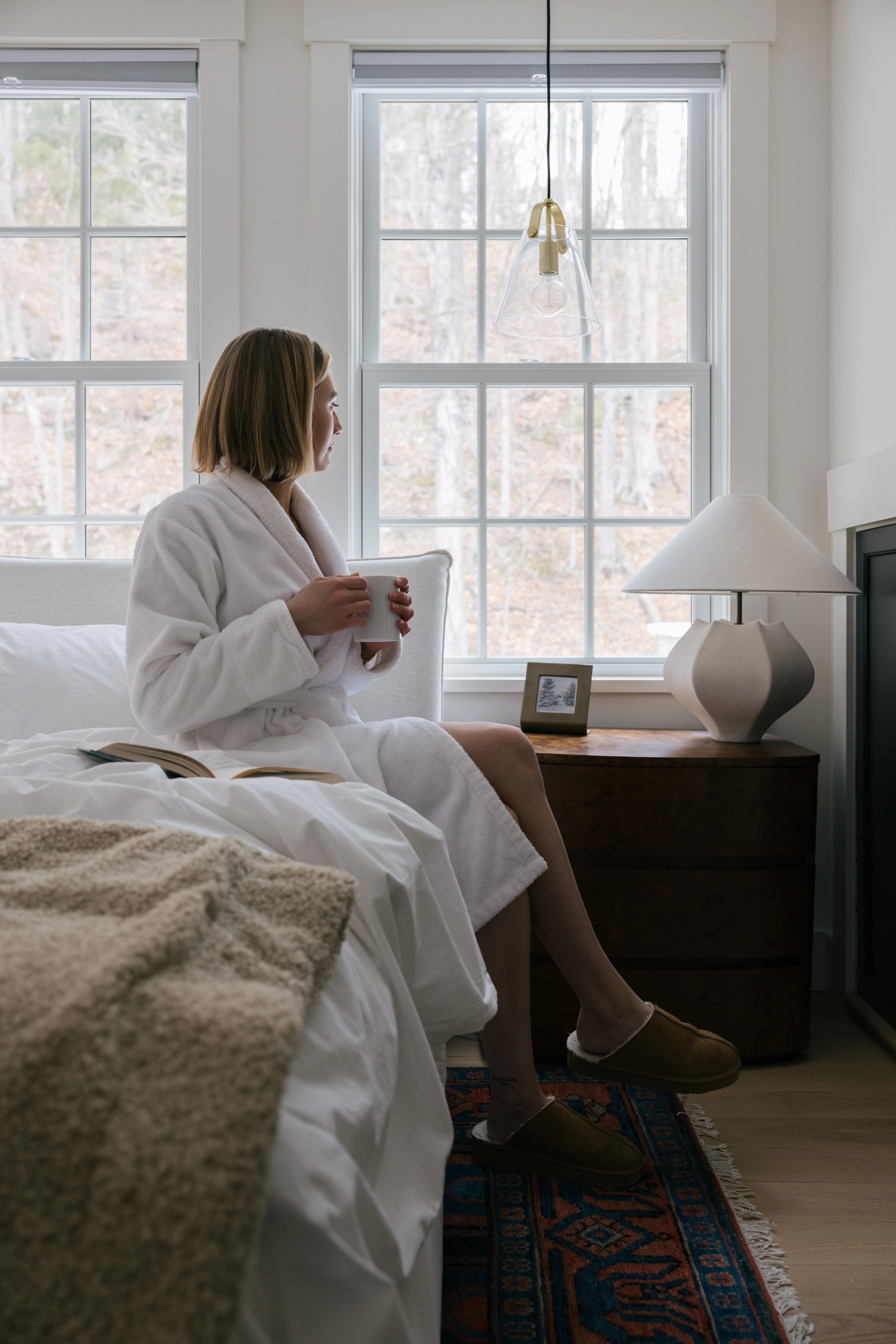Breakfast in bed lifestyle shot in the master bedroom with tray, coffee, and morning light